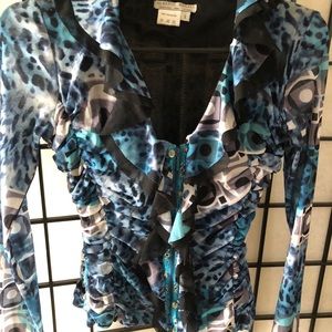 Form fitting top with zip front and ruffles
